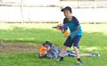 Auckland, New Zealand, 10th of Nov 2019, adults and kids playing nerf gun together at an outdoor children playground