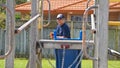 Auckland, New Zealand, 10th of Nov 2019, adults and kids playing nerf gun together at an outdoor children playground