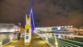 AUCKLAND, NZ - AUGUST 26, 2018: Waterfront bridge and buildings at night