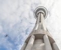 Auckland sky tower from below view with model bungee jumping against the sky.