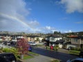 Rainbow over residential buildings at North Shore, Auckland, New Zealand Royalty Free Stock Photo