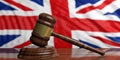 Auction gavel on UK flag background. 3d illustration