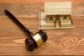 Auction. Law. Miniature House on wooden table and Court Gavel