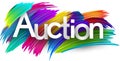 Auction paper word sign with colorful spectrum paint brush strokes over white Royalty Free Stock Photo
