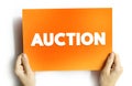 Auction is a process of buying and selling goods or services by offering them up for bids, taking bids, and then selling the item