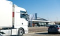 Audi car dealership in Germany view through truck and cars