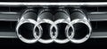 Audi logo emblem on car front, closeup