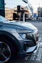 Audi Q5 e-tron luxury electric car parked on street, closeup side view