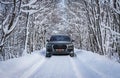 Audi Q7 on a snowy forrest road Royalty Free Stock Photo