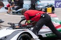 Audi Racing team member checking a racecar