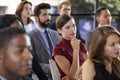 Audience at a business seminar listening to a speaker