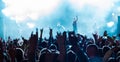 Audience crowd people raise hands enjoy live music festival concert event. Royalty Free Stock Photo