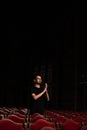 A male spectator in an empty concert hall applauds standing Royalty Free Stock Photo