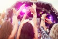 Audience with hands in the air at a music festival Royalty Free Stock Photo