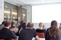 Audience in the lecture hall listening to academic presentation. Royalty Free Stock Photo