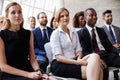 Audience Listening To Speaker At Business Conference