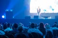 Audience listening to speaker in neon light