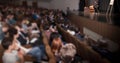 Audience listens to the speaker`s report in a spacious conference room Royalty Free Stock Photo