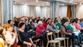 Audience listens to the speech of the lecturer in the conference hall Lutsk Ukraine 22.01.2019
