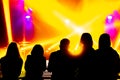 The audience looks at the variety show, the rays of stage lights Royalty Free Stock Photo