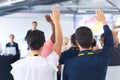 Audience raising their hands in a business conference Royalty Free Stock Photo