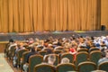 Audience in Theater. closed stage curtain in a theater. blurry