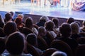 The audience in the theater watching a play. The audience in the hall: adults and children Royalty Free Stock Photo