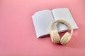Audio book concept , white book with headphones Royalty Free Stock Photo