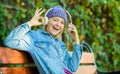 Audio book. style and music. hipster woman in headphones. relax in park with headphones. hipster girl with mp3 player Royalty Free Stock Photo