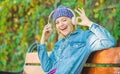 Audio book. style and music. hipster woman in headphones. relax in park with headphones. hipster girl with mp3 player Royalty Free Stock Photo