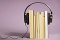 Audio books concept with books and headphones Royalty Free Stock Photo