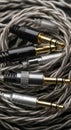 Audio cables with gold and silver connectors Royalty Free Stock Photo