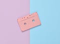 Audio cassette on a colored paper background. Retro media technology 80s. Music, entertainment. Top view. minimalism trend. Royalty Free Stock Photo