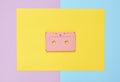 Audio cassette on a colored paper background. Retro media technology 80s. Music, entertainment. Top view. minimalism trend. Royalty Free Stock Photo