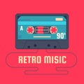 Audio cassette on red background. Retro music 90s. Royalty Free Stock Photo