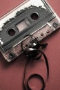 Audio cassette tape on red backgound Royalty Free Stock Photo