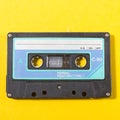 audio compact cassette on a yellow background Royalty Free Stock Photo