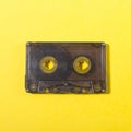 audio compact cassette on a yellow background Royalty Free Stock Photo