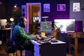 Audio composer playing piano electronic keyboard to create a new track