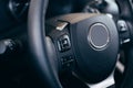 Audio control buttons on the steering wheel of a modern car Royalty Free Stock Photo