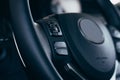 Audio control buttons on the steering wheel of a modern car Royalty Free Stock Photo