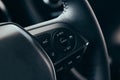 Audio control buttons on the steering wheel of a modern car Royalty Free Stock Photo