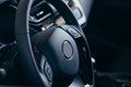 Audio control buttons on the steering wheel of a modern car Royalty Free Stock Photo