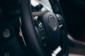 Audio control buttons on the steering wheel of a modern car Royalty Free Stock Photo