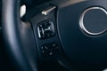 Audio control buttons on the steering wheel of a modern car Royalty Free Stock Photo