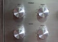 Audio control knobs on aluminun plated backgroubd