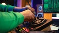 Audio engineer with headset mixing and mastering his recorded files