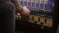 Audio engineer uses audio compressor in recording studio Royalty Free Stock Photo
