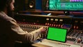 Audio expert mixing and mastering tunes on editing software