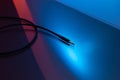 Audio Headphones and Microphones Cable Jack connector, Dark Background and colorful Light. Royalty Free Stock Photo